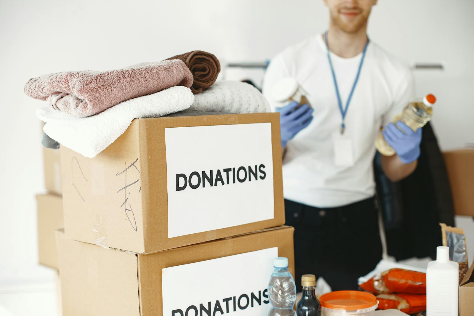 Donation boxes and supplies organized on a table for a respectful cleanout